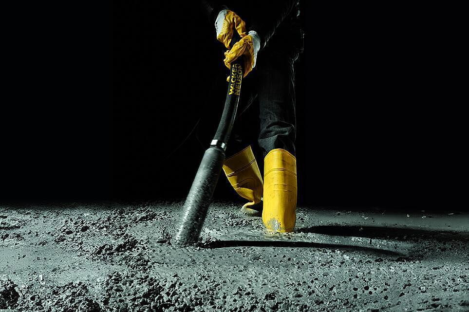 concrete consolidation with an internal vibrator in action