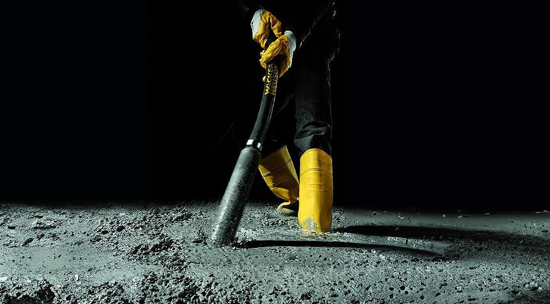 concrete consolidation with an internal vibrator in action