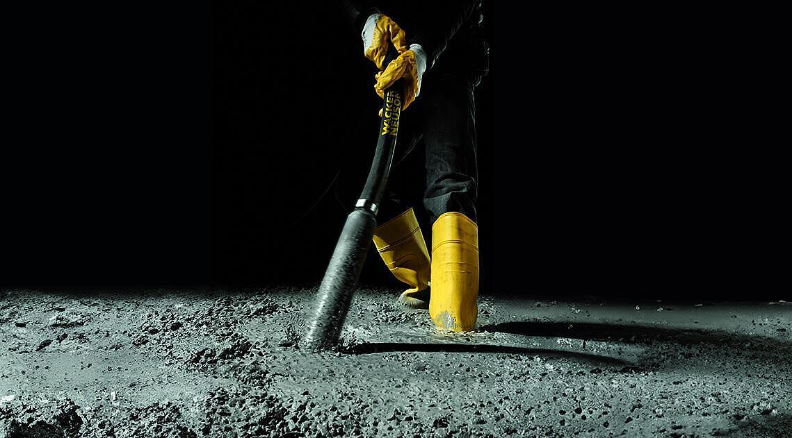 concrete consolidation with an internal vibrator in action