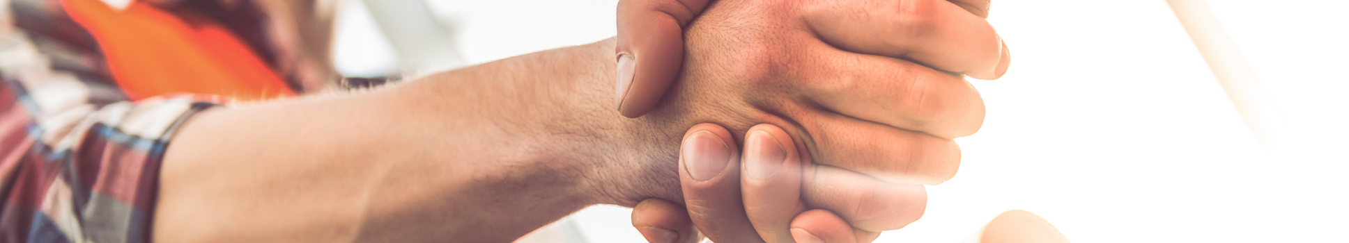 Handshake on a construction site.