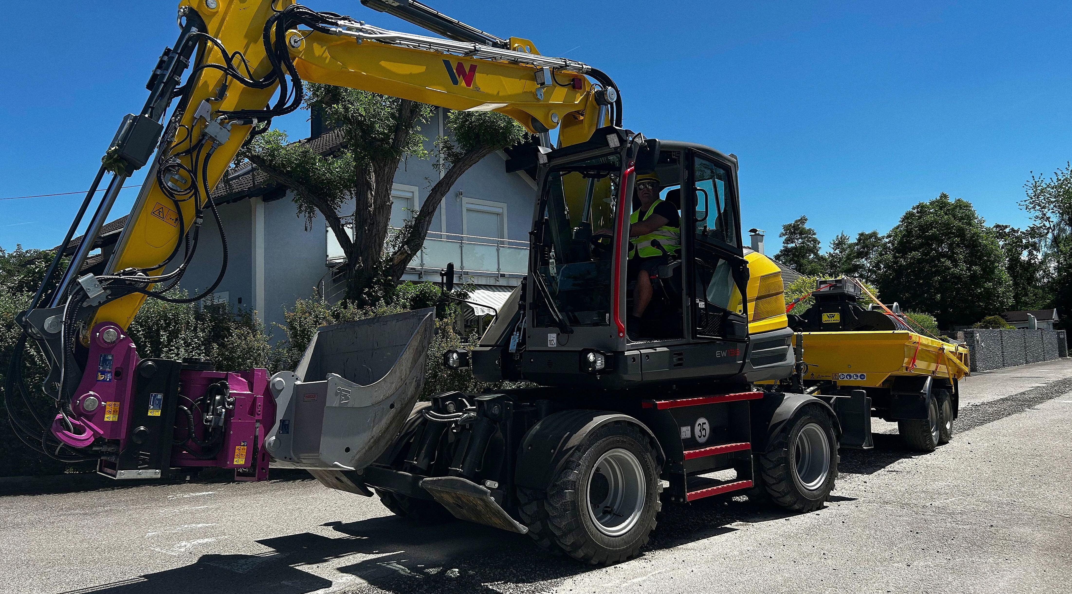excavator EW135 on street with Trailer