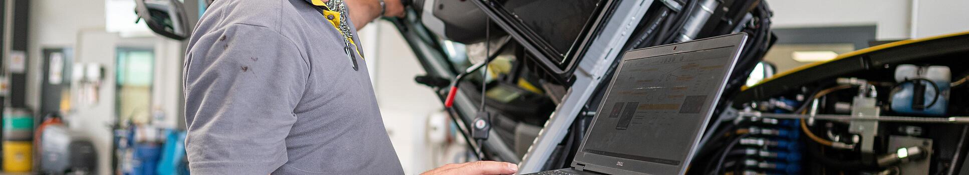 wacker neuson employee checks machine