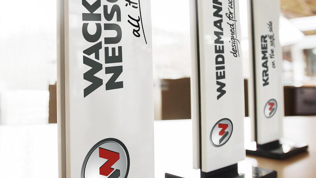 Die drei Wacker Neuson Group Marken: Wacker Neuson, Weidemann und Kramer.