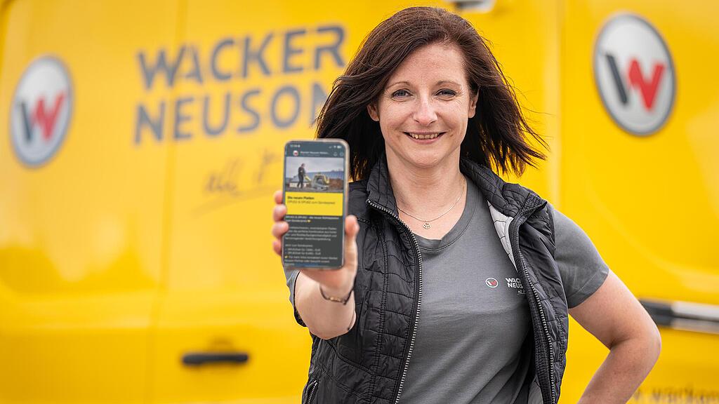 woman holding a smartphone in the camera